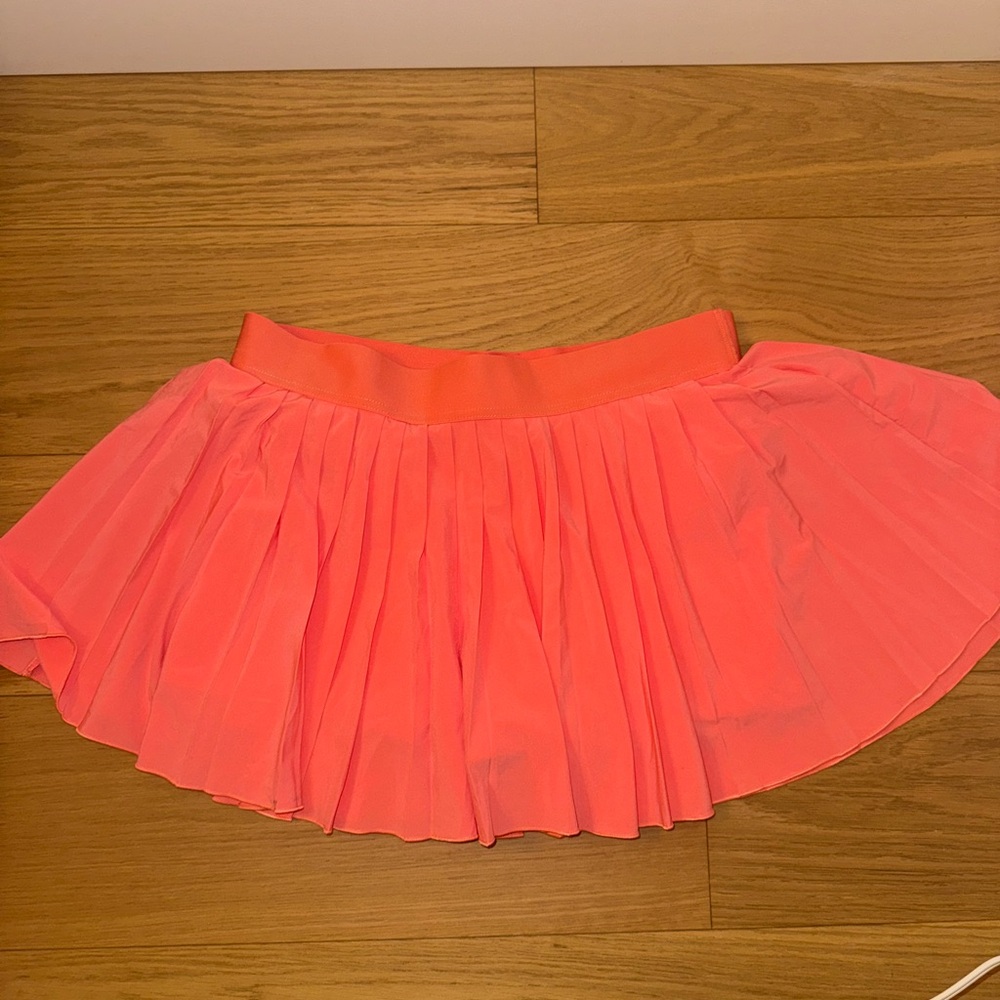 TNA pink action tennis skirt with built in shorts